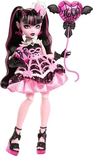 Draculaura birthday doll in pink party dress with bat balloon
